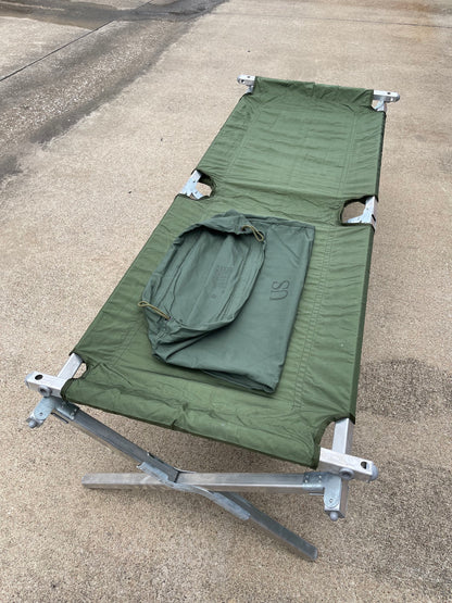 Genuine US military heavy duty steel frame sleeping folding camping cot new &   Mosquito Netting with poles and Free US GI Laundry bag.