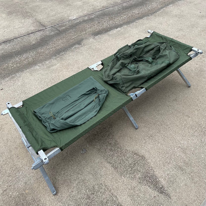 Genuine US military heavy duty steel frame sleeping folding camping cot new &   Mosquito Netting with poles and Free US GI Laundry bag.