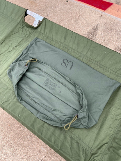 Genuine US military heavy duty steel frame sleeping folding camping cot new &   Mosquito Netting with poles and Free US GI Laundry bag.