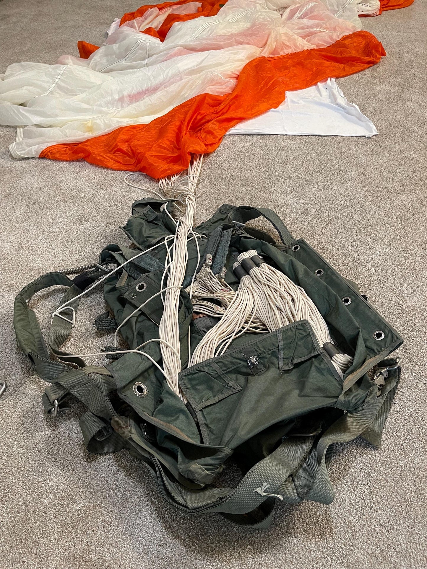 US military 28 ft. Round Orange and white Nylon Parachute with harness , lines and small white chute,