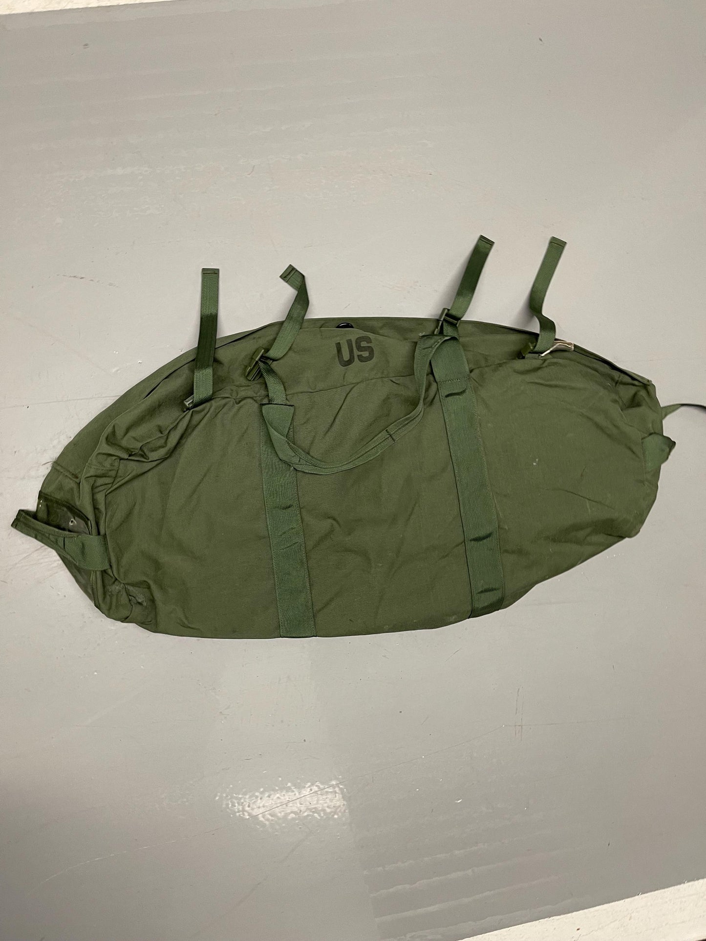 Genuine US Military OD green Improved duffle bag with backpack shoulder straps.