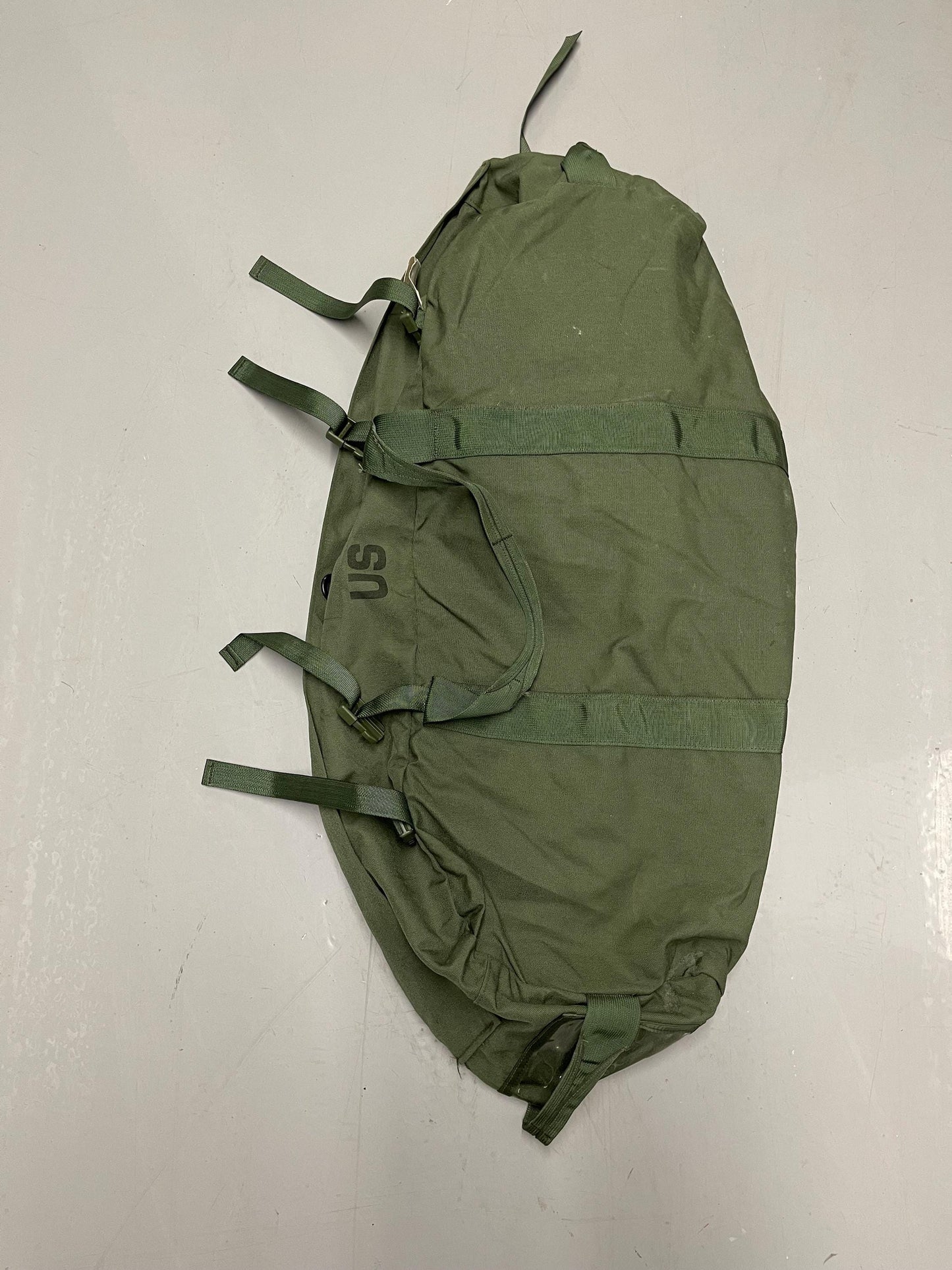 Genuine US Military OD green Improved duffle bag with backpack shoulder straps.